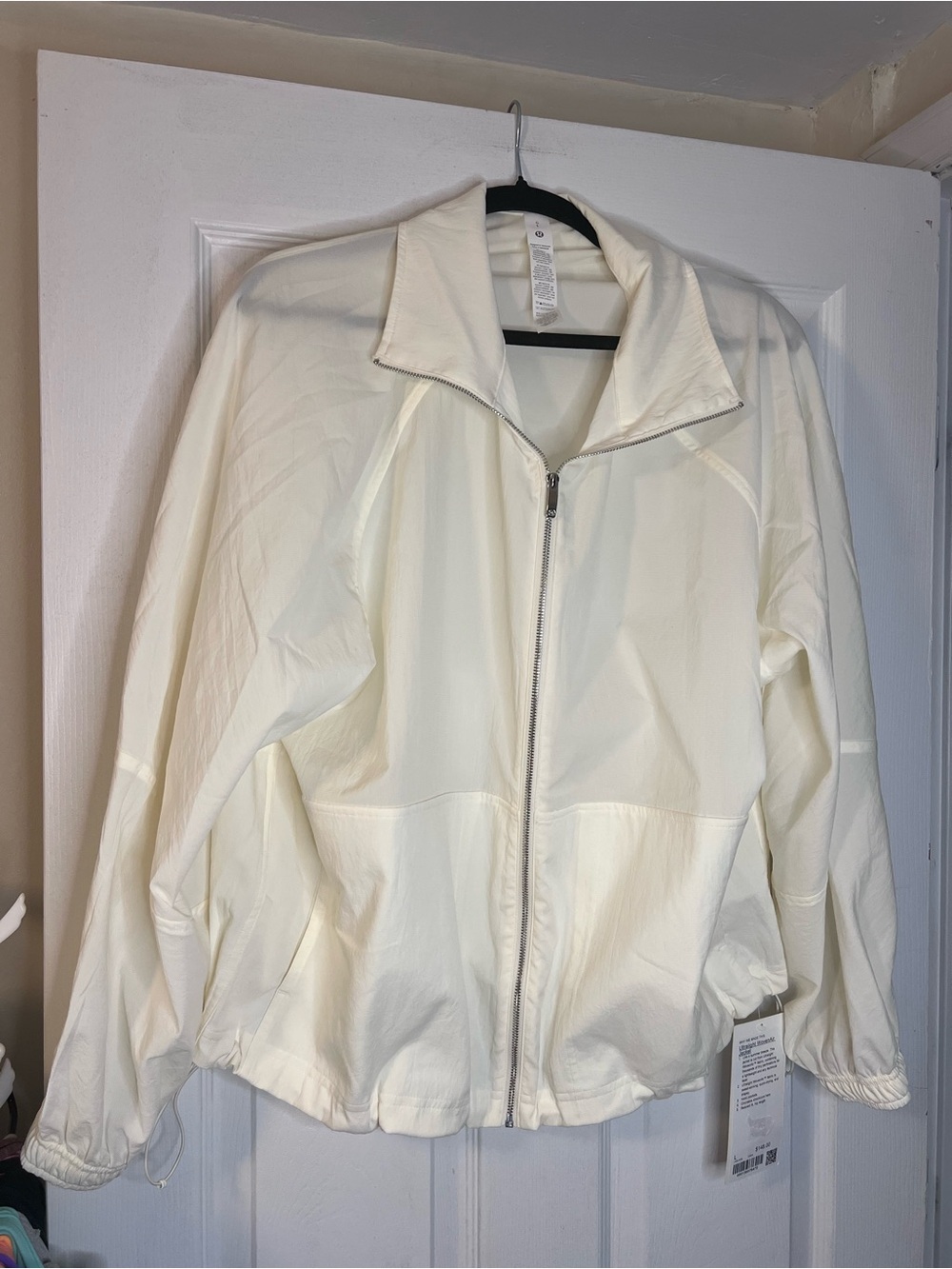 #862 Lululemon Ultralight WovenAir Jacket Coconut Ivory L NWT - Picture 3 of 5